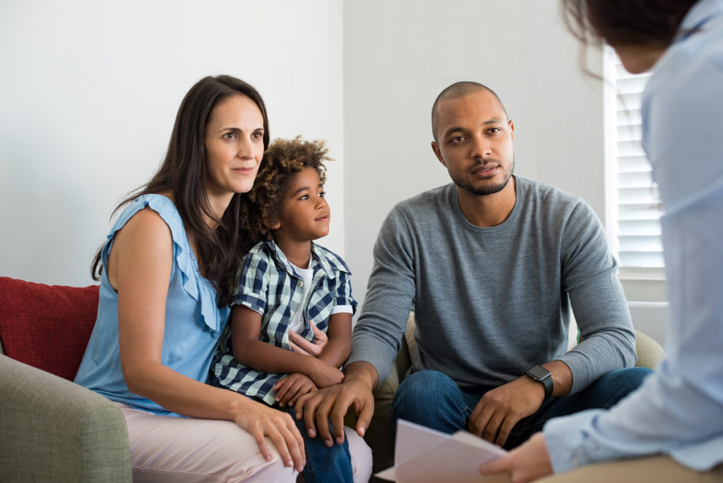 couple-child-talking-to-family-counselor