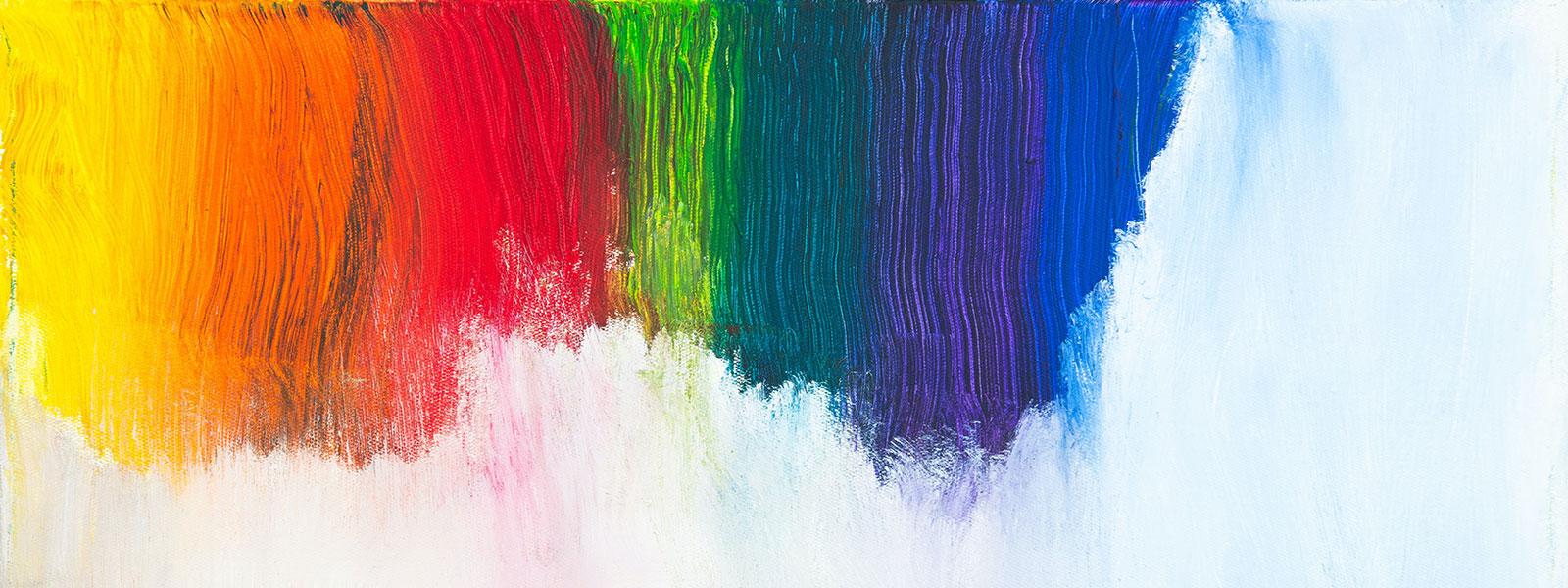 rainbow colored paint on a white canvas