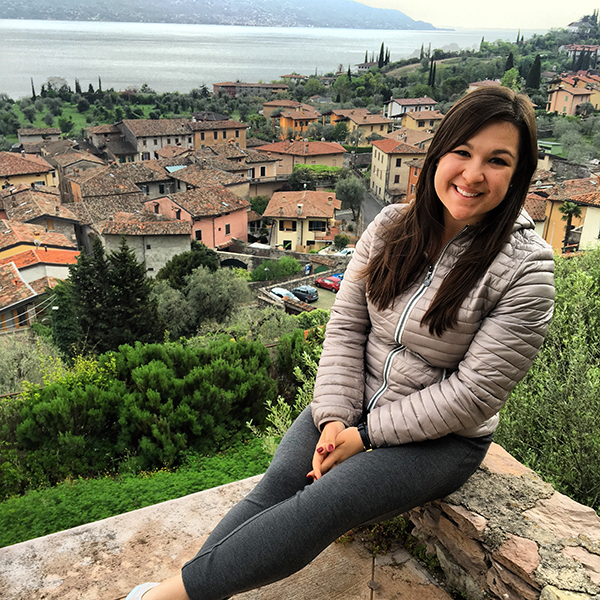 photo of Jenna Azotea in front of a village in Italy