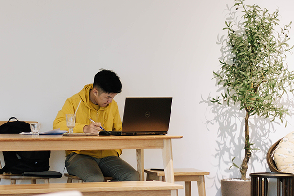 photo of a student working remotely on a laptop