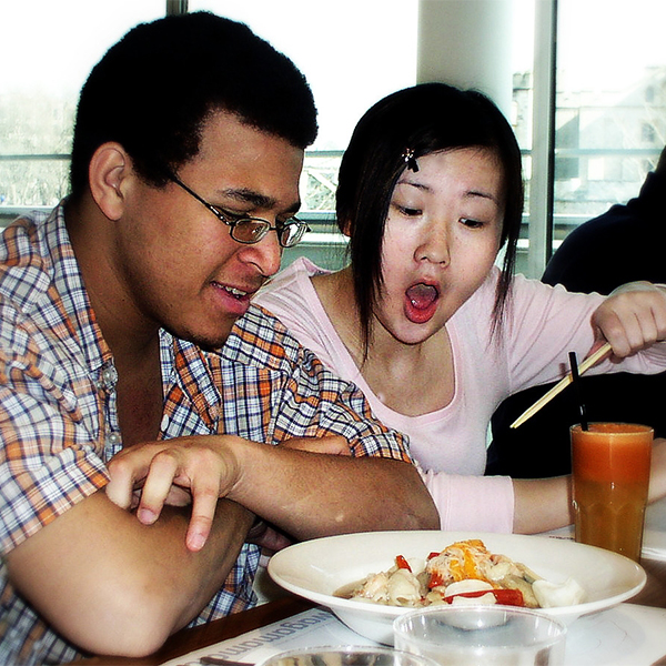 photo of two people eating at a restaurant