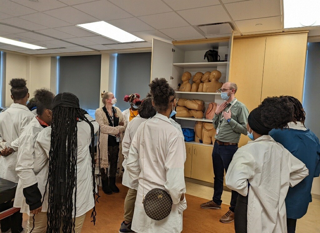 group of students listening to a speaker